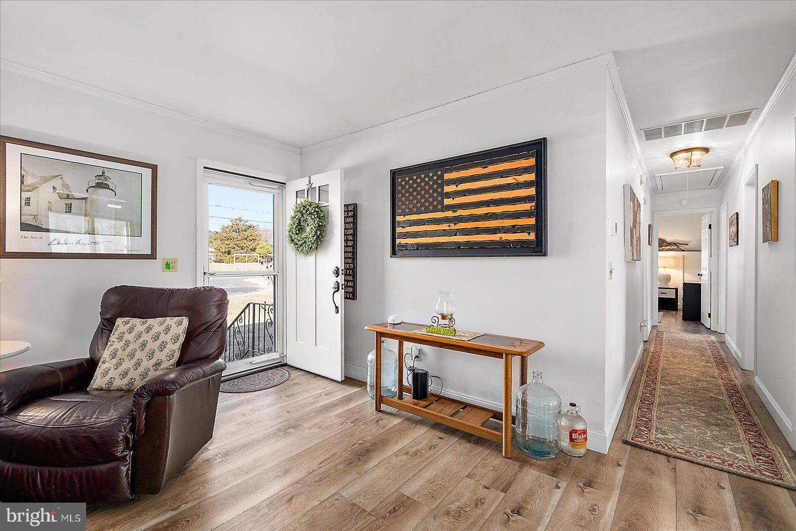 30069 Cedar Neck Road Ocean View, DE 19970 - Photo 4 of 61 a living room with furniture and a baby crib
