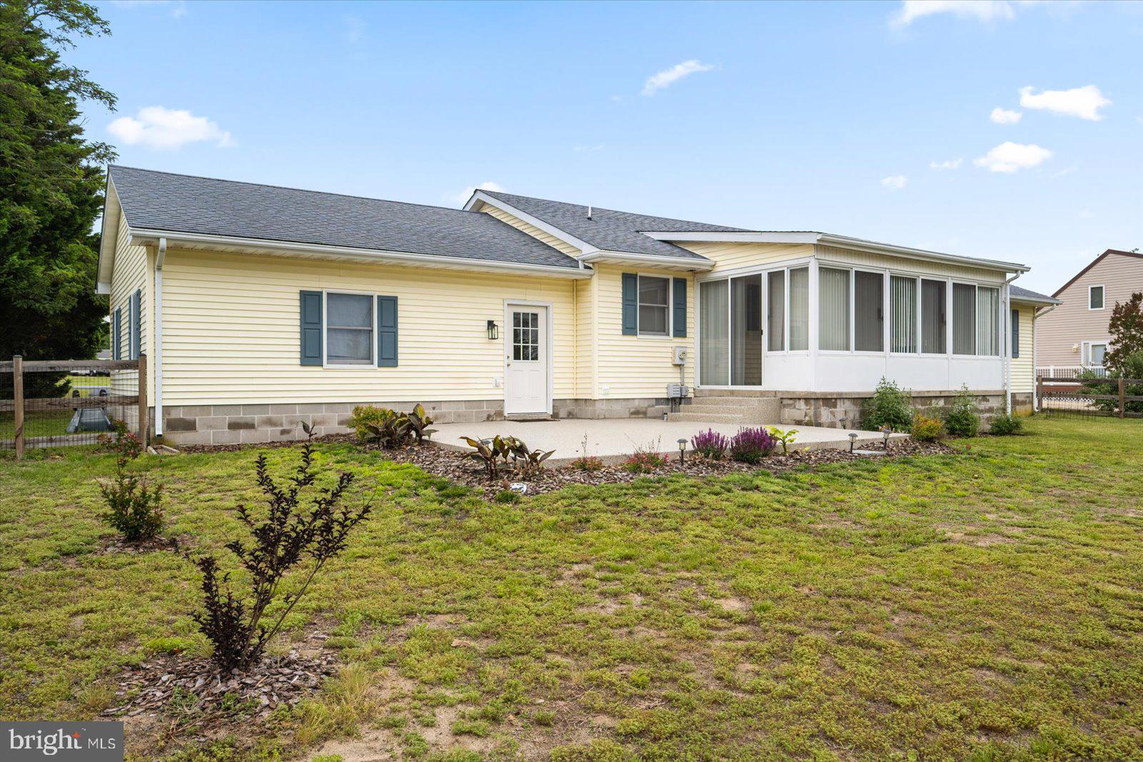 30069 Cedar Neck Road Ocean View, DE 19970 - Photo 46 of 61 a front view of a house with a yard