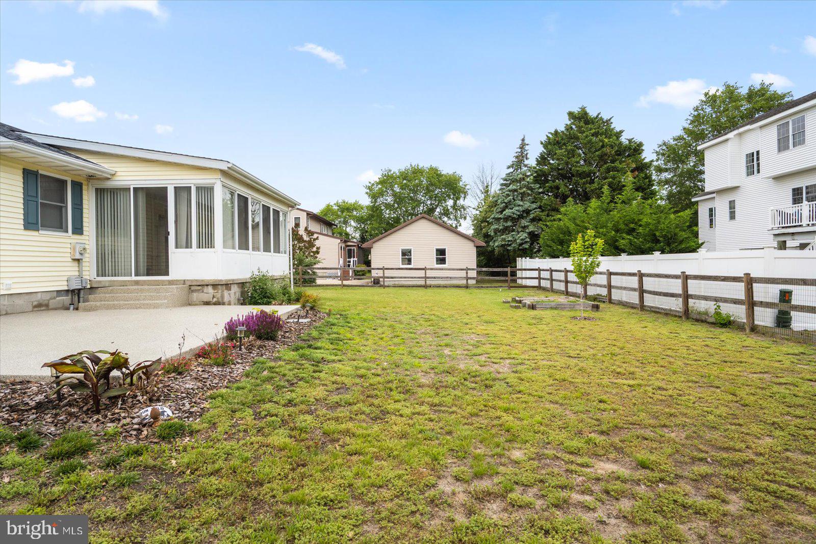 30069 Cedar Neck Road Ocean View, DE 19970 - Photo 47 of 61 a view of a house with a yard