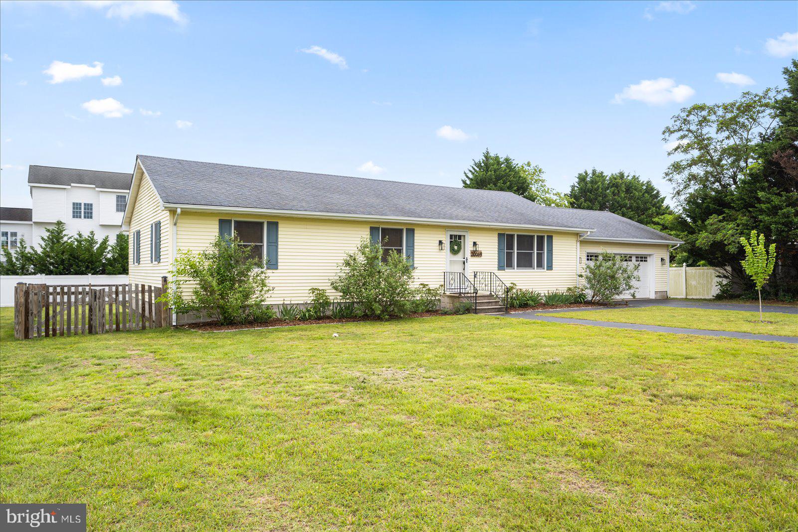 30069 Cedar Neck Road Ocean View, DE 19970 - Photo 49 of 61 a view of a house with a swimming pool and a yard