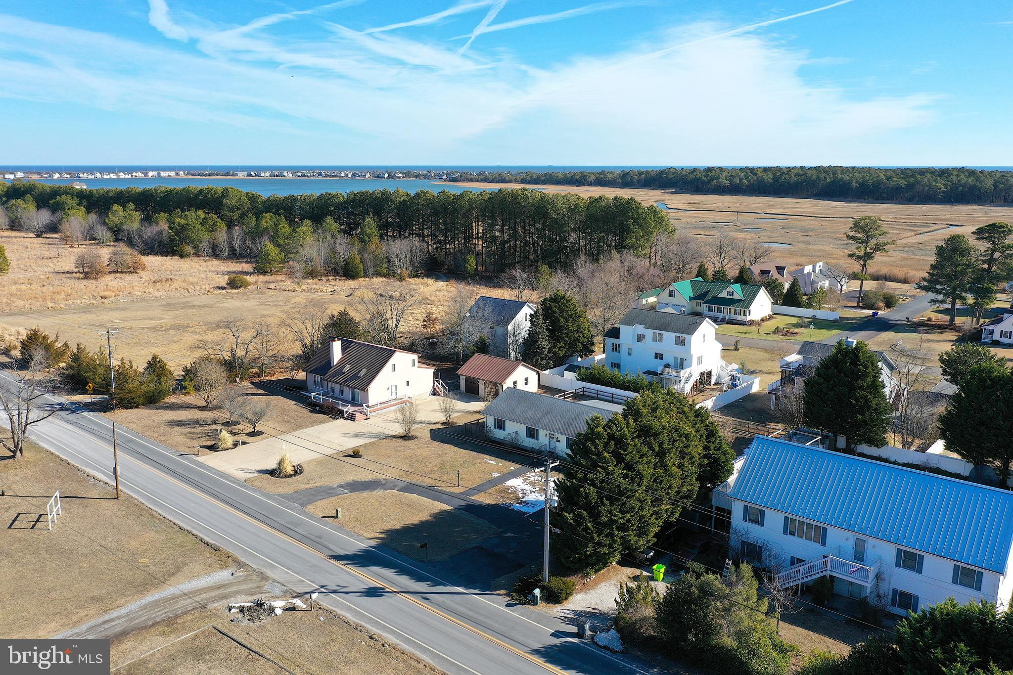 30069 Cedar Neck Road Ocean View, DE 19970 - Photo 52 of 61 a terrace with outdoor seating and city view