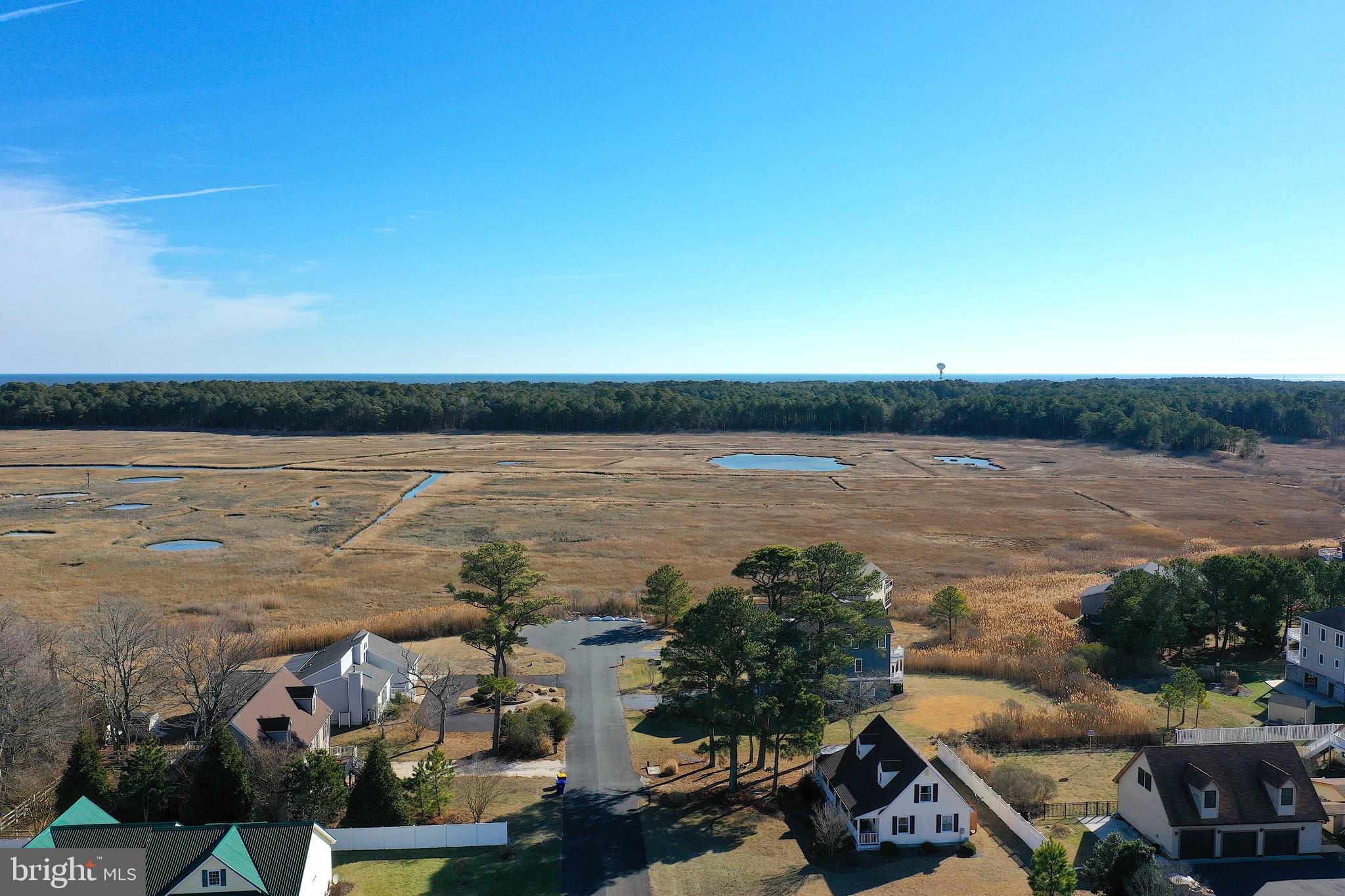 30069 Cedar Neck Road Ocean View, DE 19970 - Photo 57 of 61 a view of a lake with outdoor space