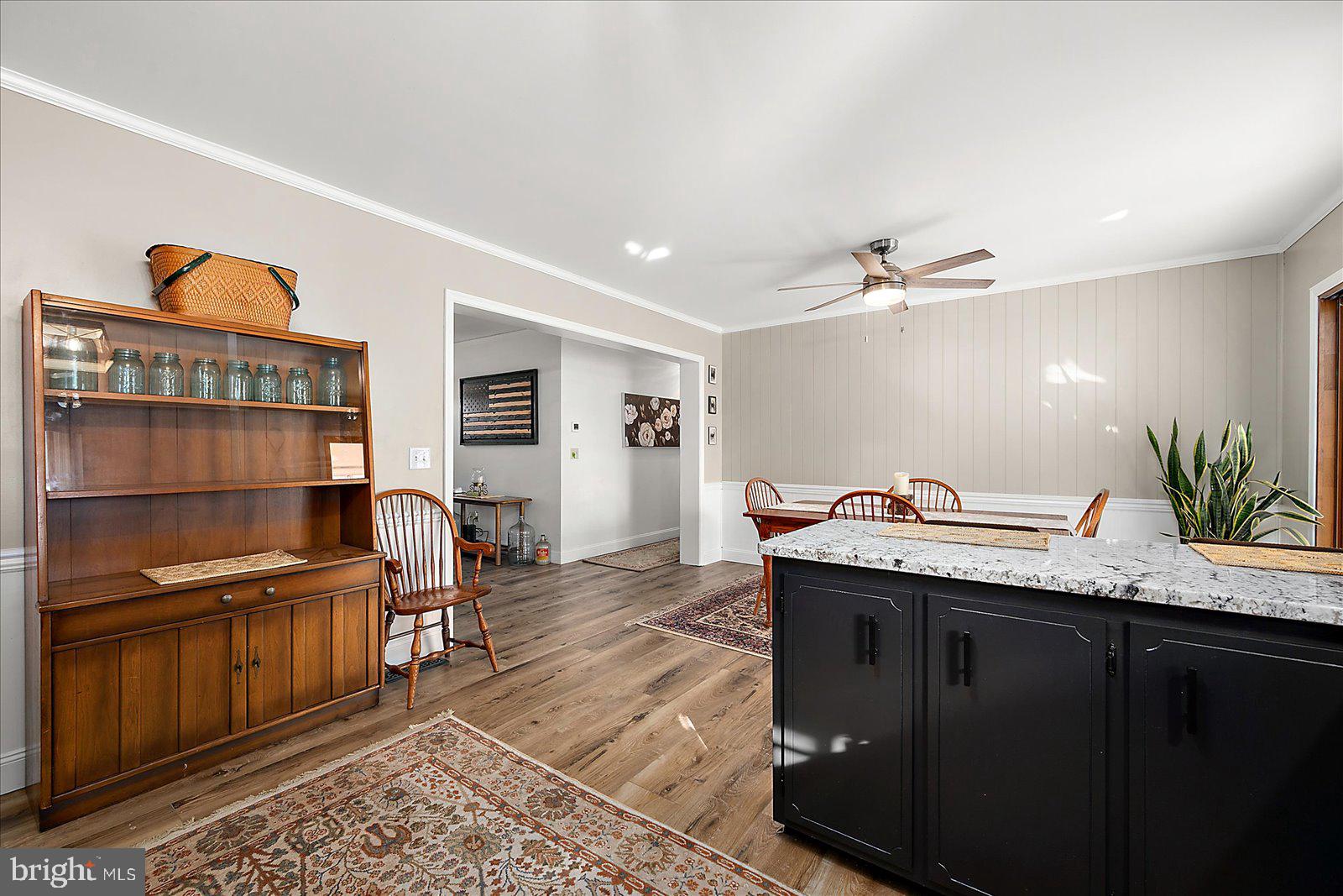 30069 Cedar Neck Road Ocean View, DE 19970 - Photo 9 of 61 a kitchen with granite countertop a sink and cabinets