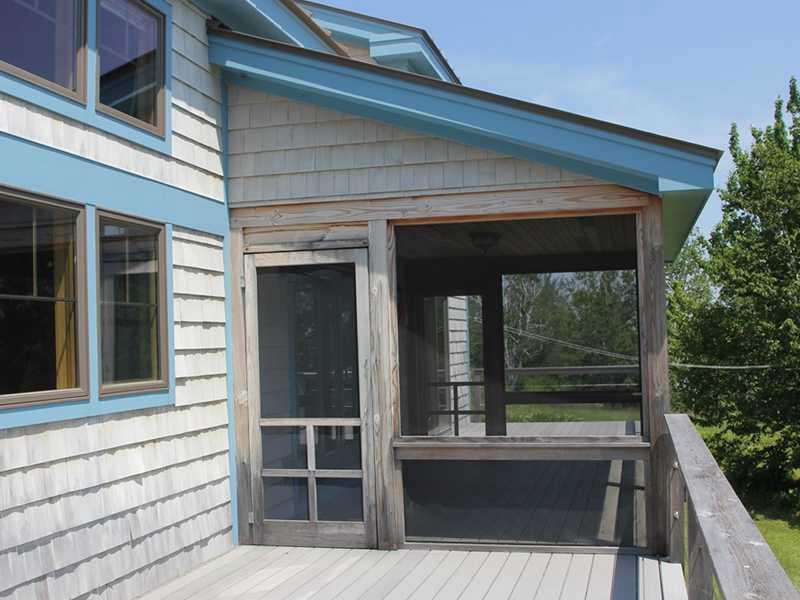 1406 Newbury Neck Road Surry, ME 04684 - Photo 14 of 18 Patio/Deck. Deck with screened porch.