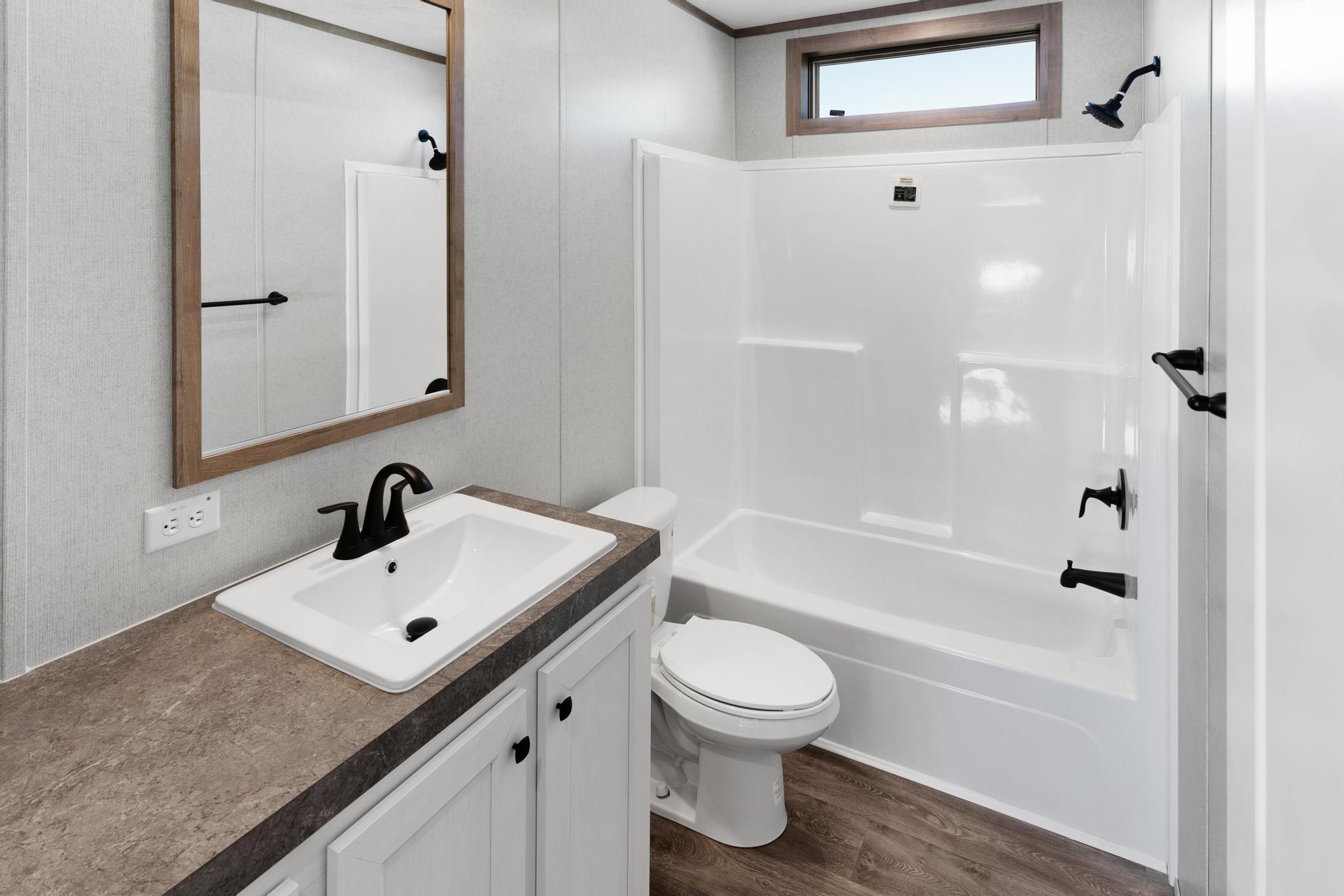 3195 F Road, Unit 8 Grand Junction, CO 81504 - Photo 11 of 26 a bathroom with a sink toilet and shower