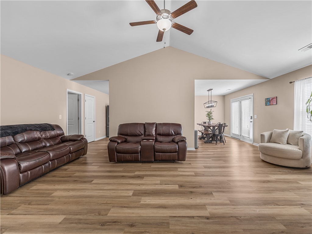 2520 Linmar Circle Anderson, SC 29621 - Photo 48 of 50 An open floorplan living area showcases rich hardwood flooring and a stylish ceiling fan.