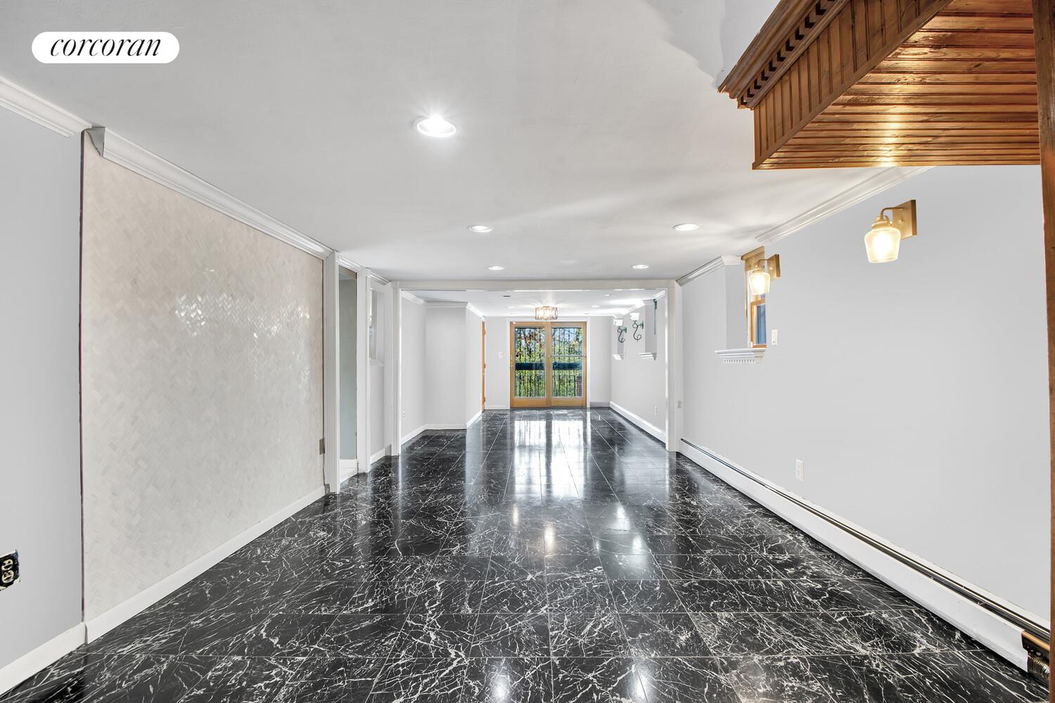 81-22 Haddon Street Queens, NY 11432 - Photo 11 of 13 a view of a hallway with wooden floor