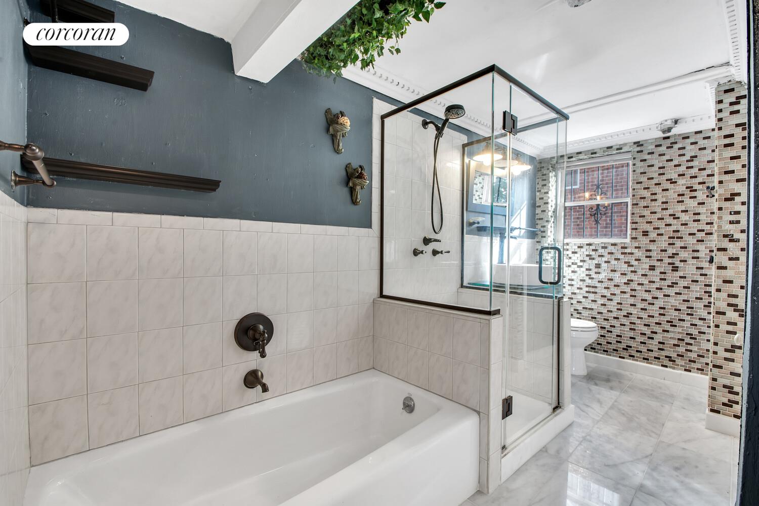 81-22 Haddon Street Queens, NY 11432 - Photo 8 of 13 a bathroom with a bathtub and shower