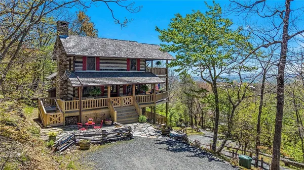 a view of house with outdoor seating