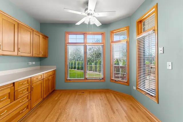 a view of a kitchen with a sink and wooden floor