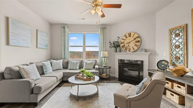 a living room with furniture and a fireplace