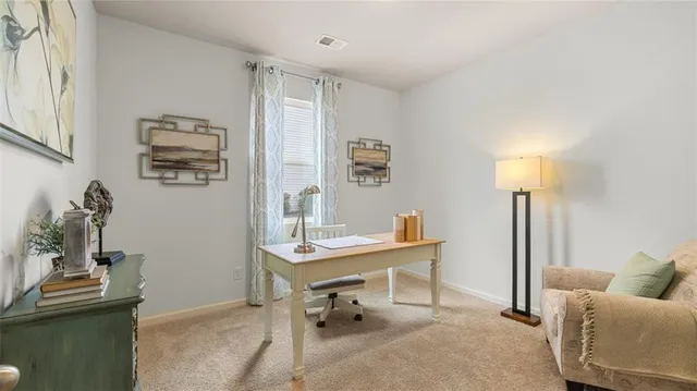 a view of a workspace with furniture