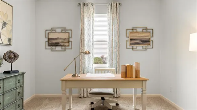 a workspace with furniture and window