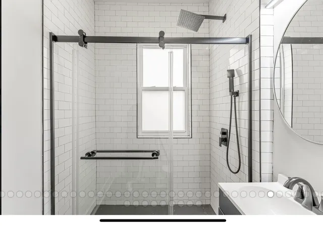 a bathroom with a sink and a shower