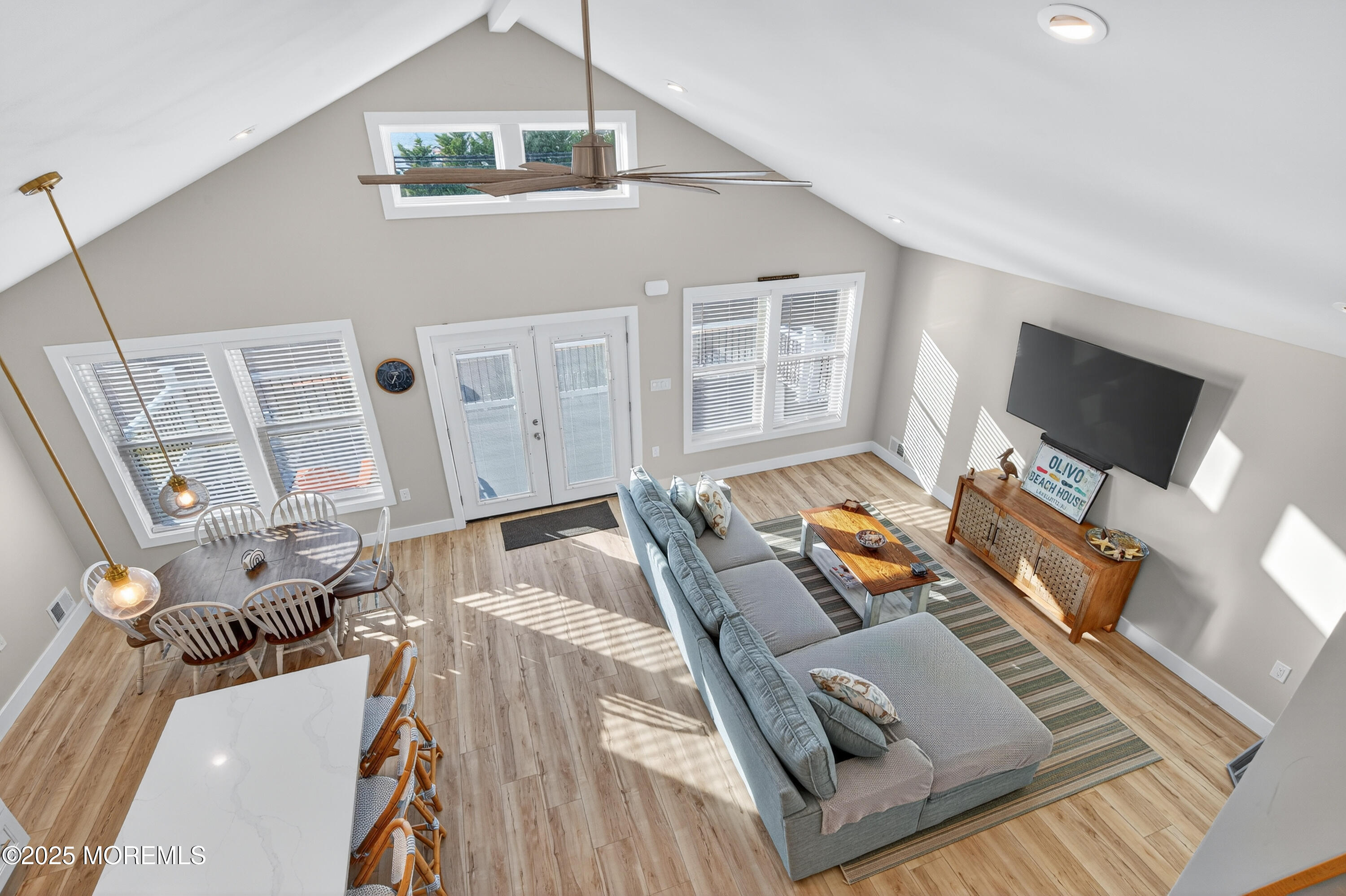 A3255 Goa Way Lavallette, NJ 08735 - Photo 26 of 34 a living room with furniture and a flat screen tv