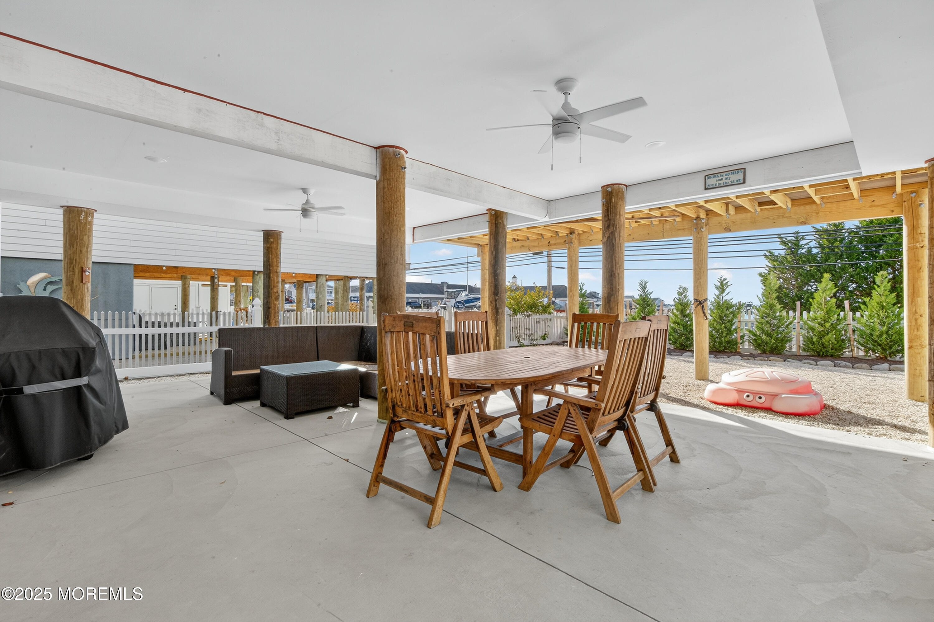 A3255 Goa Way Lavallette, NJ 08735 - Photo 29 of 34 a dining room with furniture and a floor to ceiling window