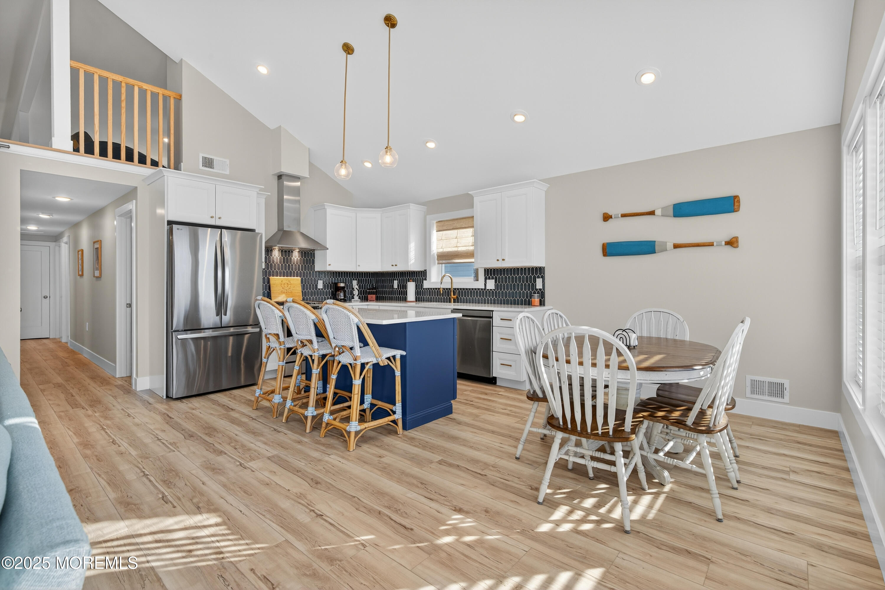 A3255 Goa Way Lavallette, NJ 08735 - Photo 7 of 34 a view of a dining room with furniture and a wooden floor
