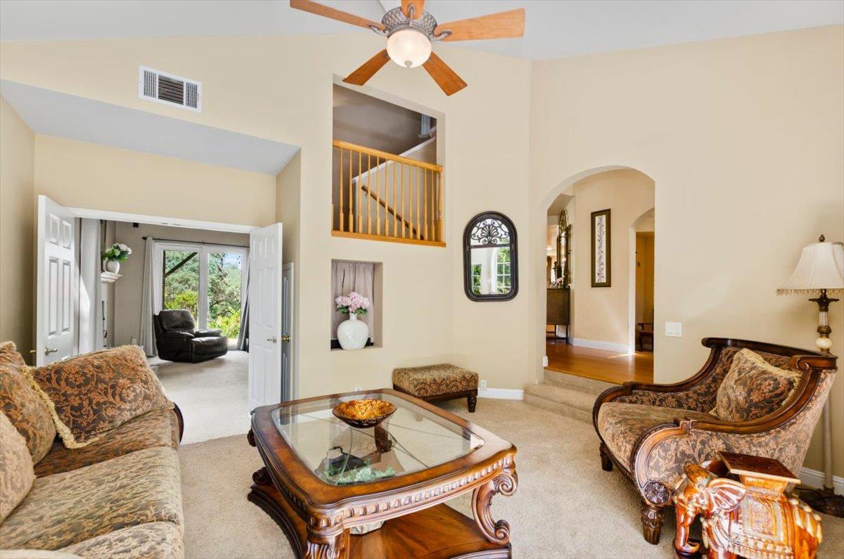 3720 Four Springs Drive Rescue, CA 95672 - Photo 11 of 34 a living room with furniture fireplace and a large mirror
