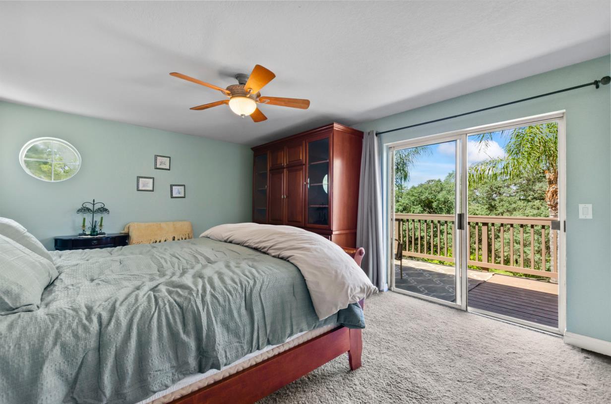 3720 Four Springs Drive Rescue, CA 95672 - Photo 15 of 34 a bedroom with a large bed and a large window