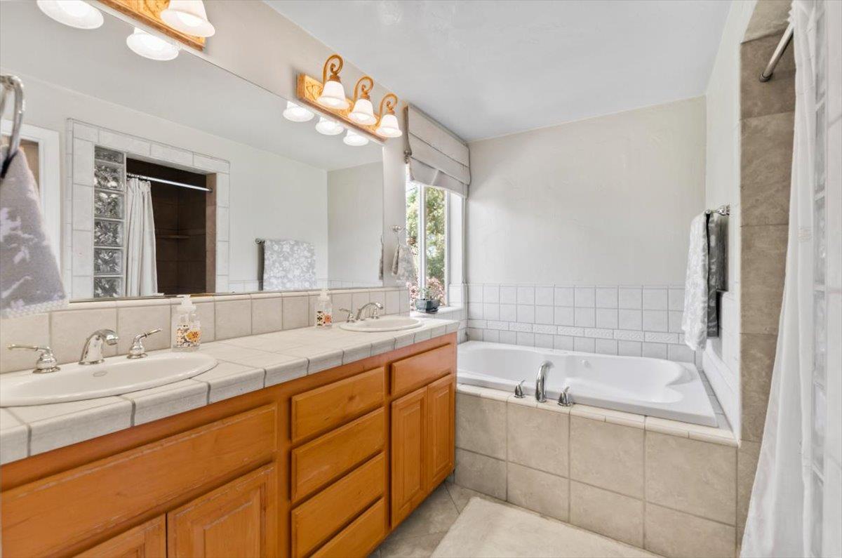 3720 Four Springs Drive Rescue, CA 95672 - Photo 16 of 34 a bathroom with a bathtub and a sink