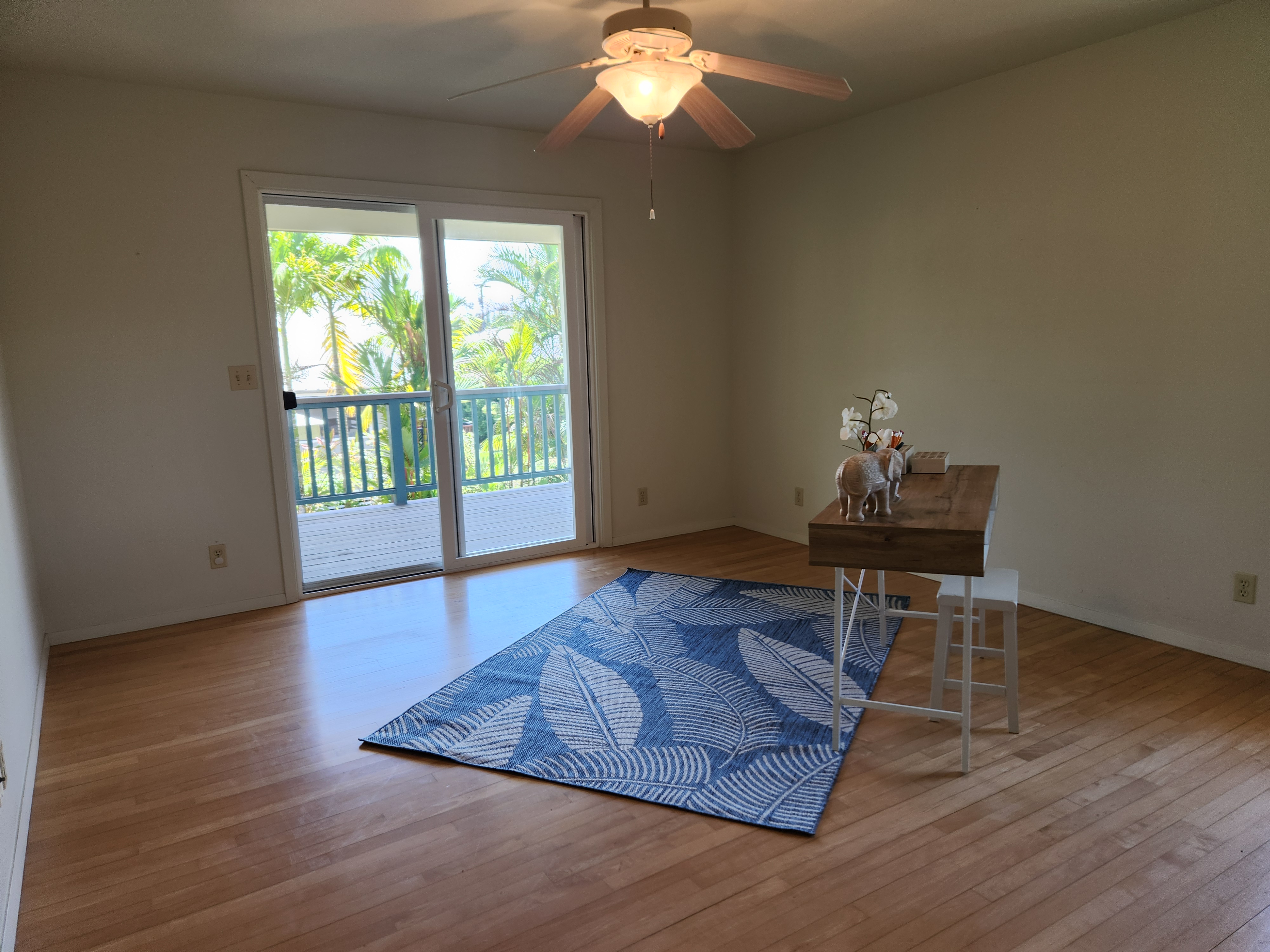 15-974 Lemiwai Road Keaau, HI 96749 - Photo 17 of 30 a view of a room with wooden floor and large windows