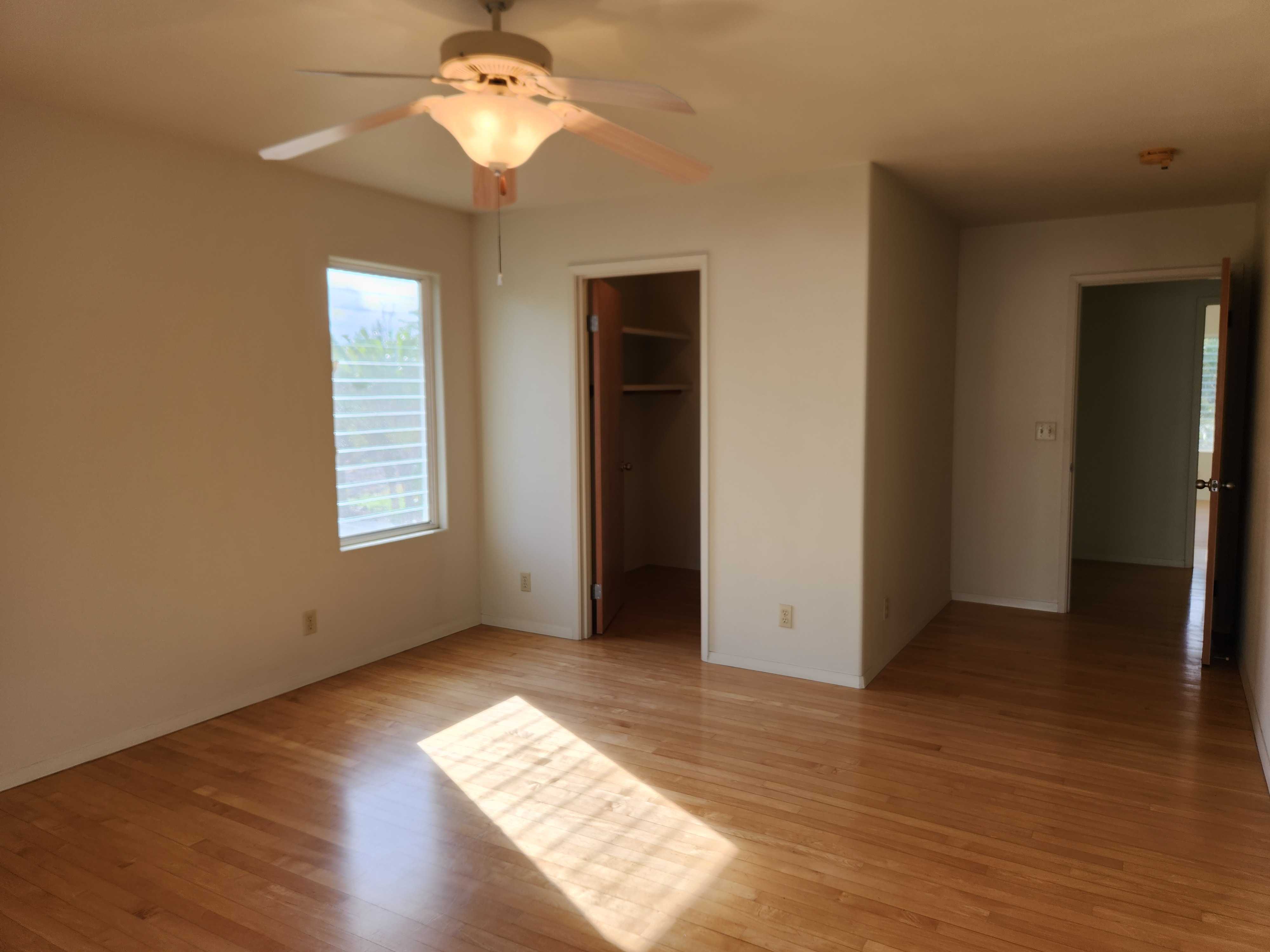 15-974 Lemiwai Road Keaau, HI 96749 - Photo 18 of 30 wooden floor in an empty room with a window