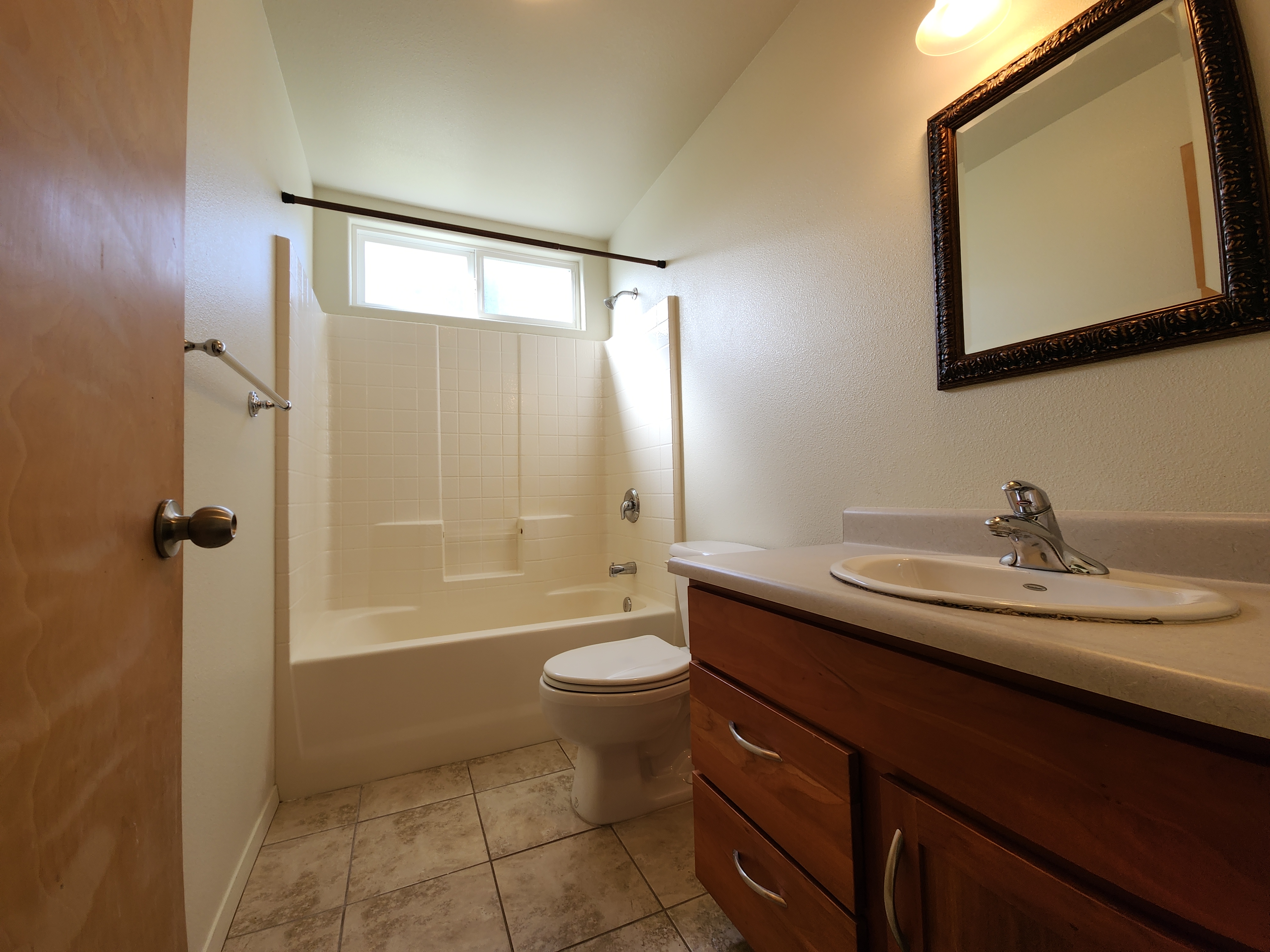 15-974 Lemiwai Road Keaau, HI 96749 - Photo 23 of 30 a bathroom with a double vanity sink toilet mirror and shower