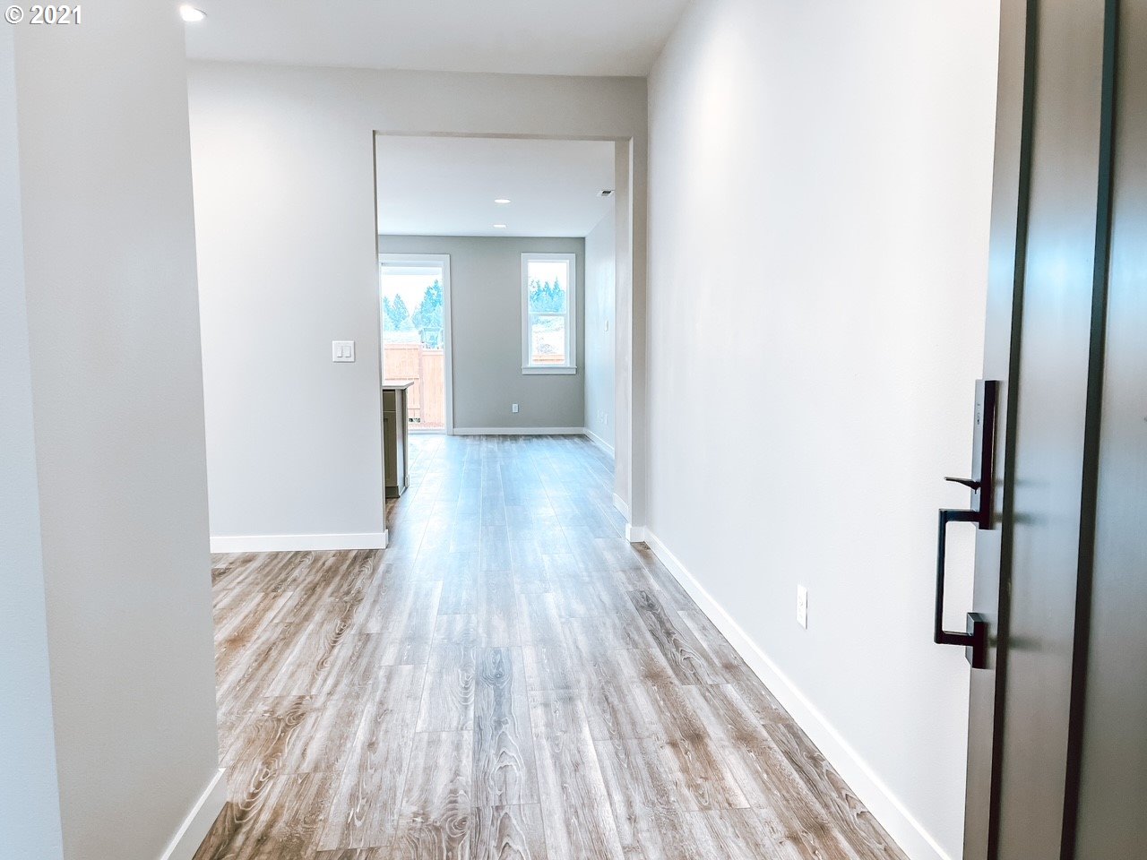 2917 North Mccanta Way Ridgefield, WA 98642 - Photo 3 of 22 a view of hallway with wooden floor