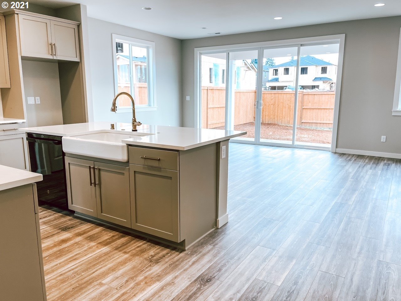 2917 North Mccanta Way Ridgefield, WA 98642 - Photo 6 of 22 a kitchen with a sink cabinets and wooden floor