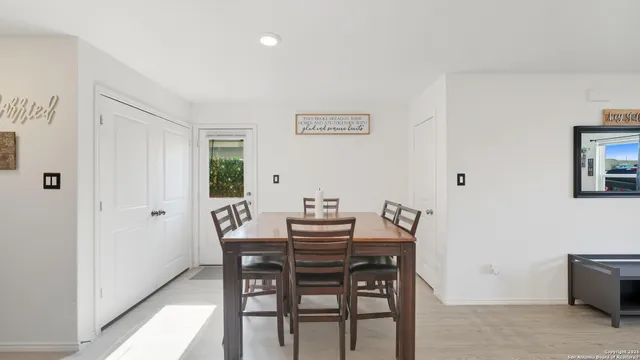 a dining room with furniture and window