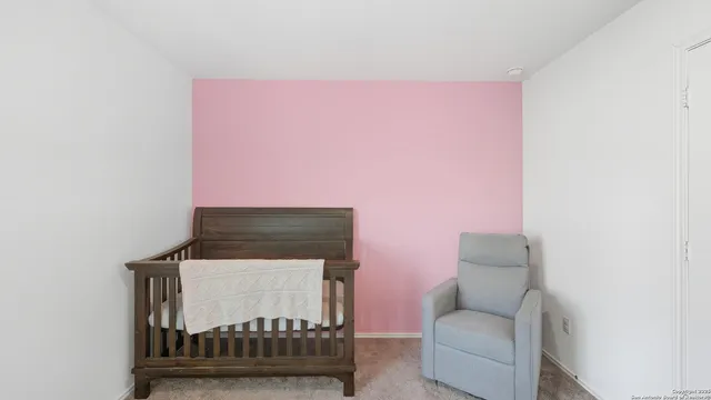 a living room with furniture a rug and a window