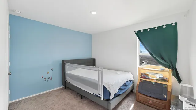 a room with a bed and a window