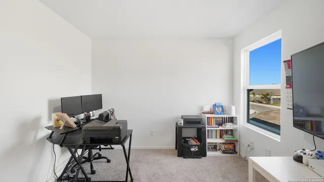 a view of a workspace with furniture