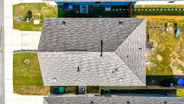 a brick building with a yard