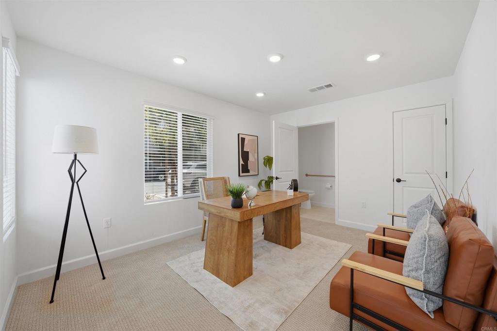 2402 Cascalote Loop San Diego, CA 92154 - Photo 14 of 35 a living room with furniture a window and a table