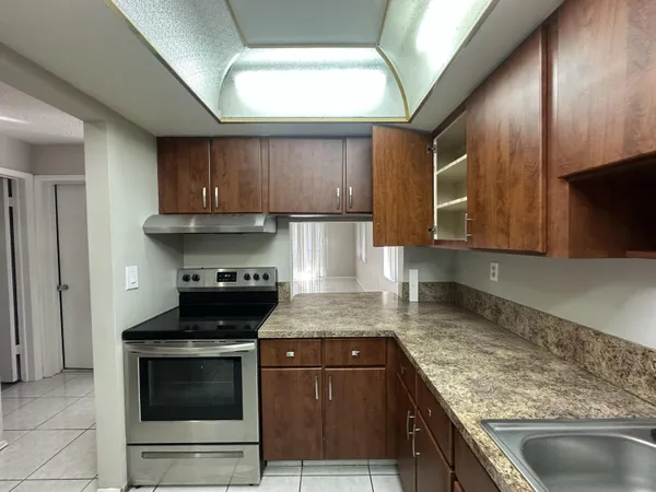 a kitchen with a stove and a sink