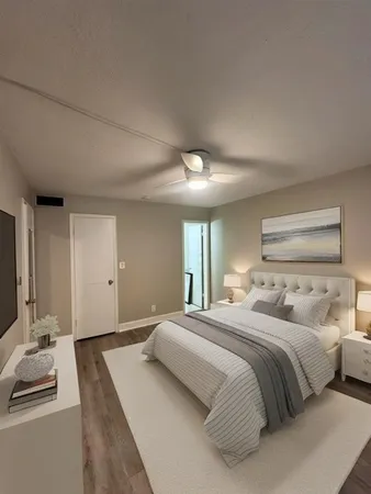 a bedroom with a bed and a large mirror