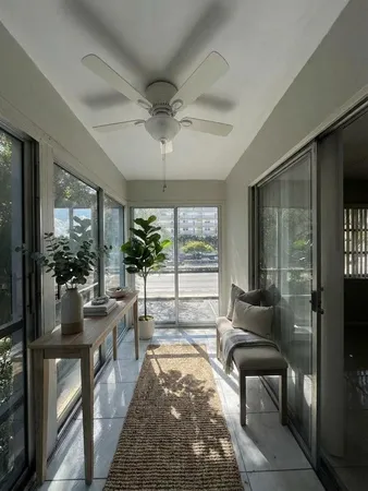 a view of a hallway with windows