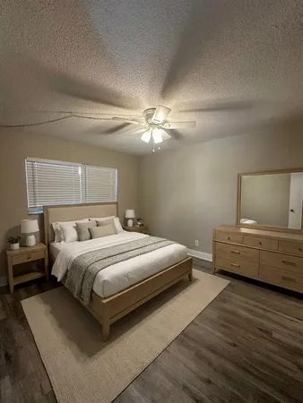 a bedroom with bed and window