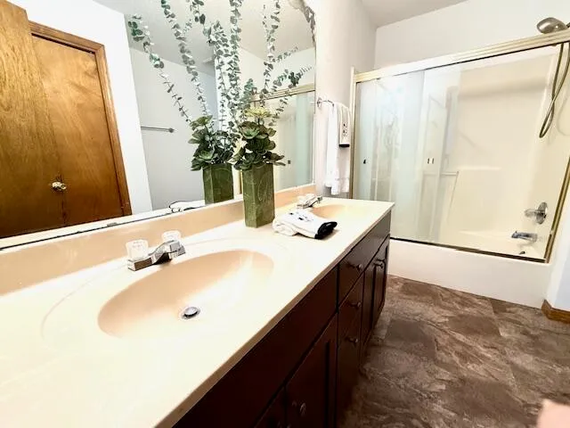 a bathroom with a sink and a mirror