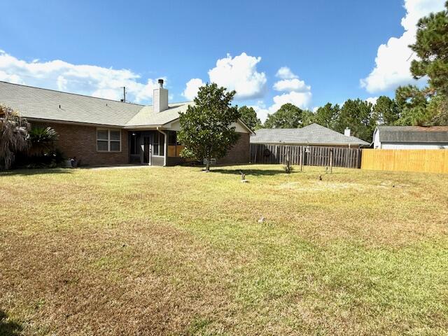 2252 Prytania Circle Navarre, FL 32566 - Photo 25 of 26 a view of a house with a swimming pool