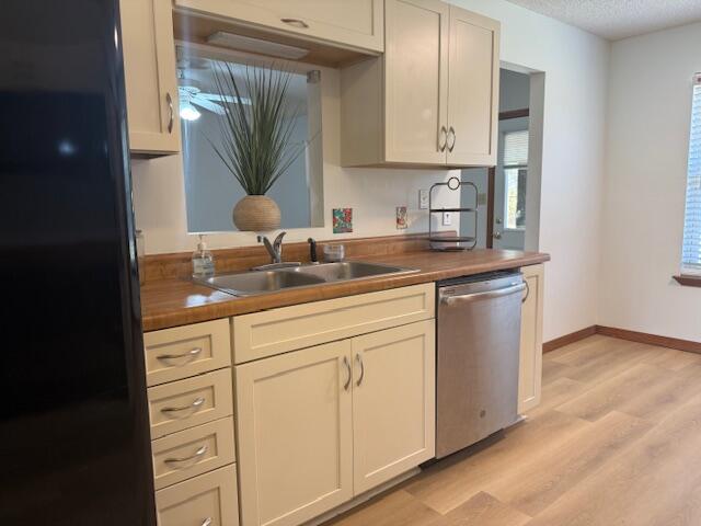 2252 Prytania Circle Navarre, FL 32566 - Photo 6 of 26 a kitchen with white cabinets and sink