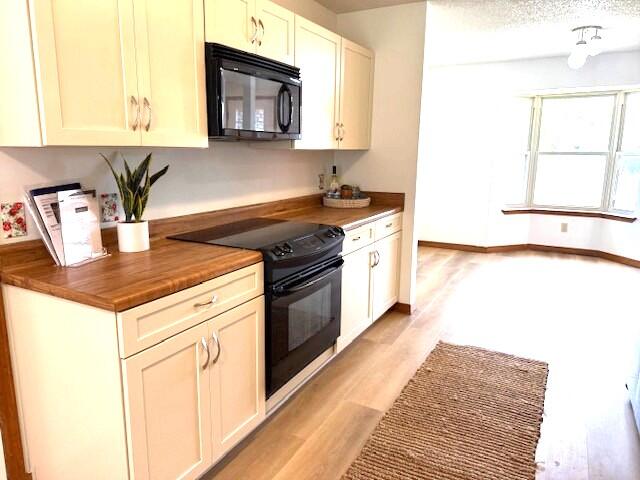 2252 Prytania Circle Navarre, FL 32566 - Photo 8 of 26 a kitchen with stainless steel appliances granite countertop a stove a sink and a microwave