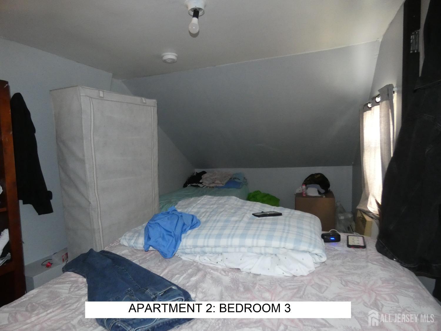 355 High Street Perth Amboy, NJ 08861 - Photo 11 of 19 a bathroom with a sink and a mirror