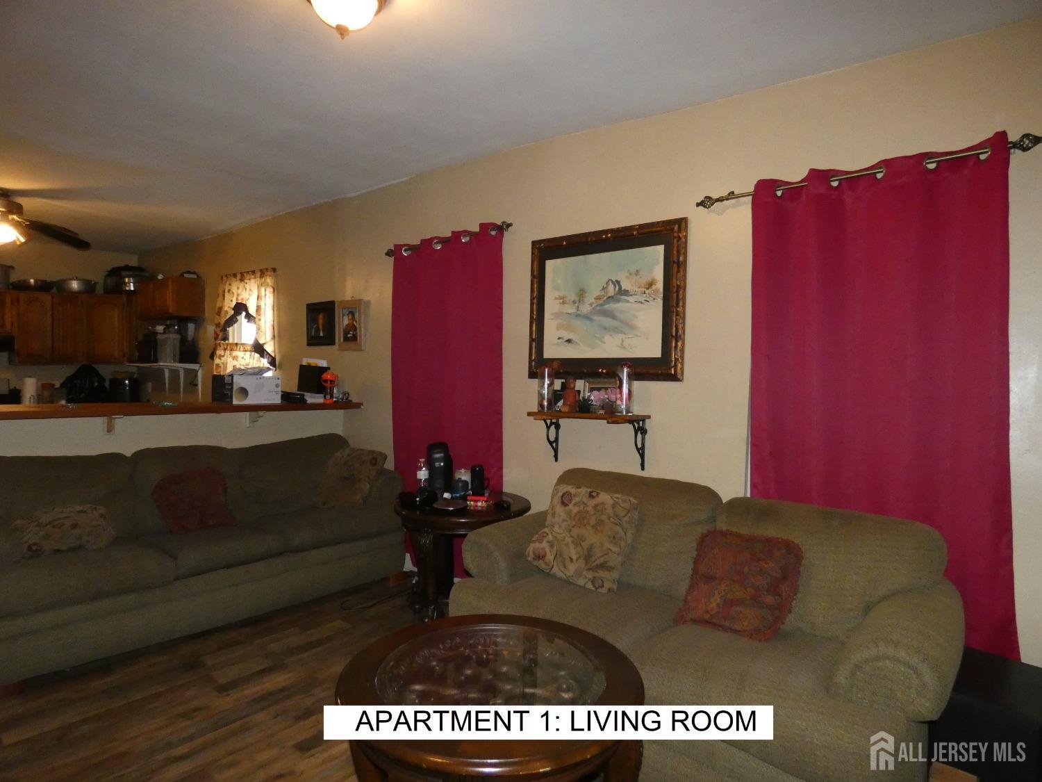 355 High Street Perth Amboy, NJ 08861 - Photo 2 of 19 a living room with furniture and a couch