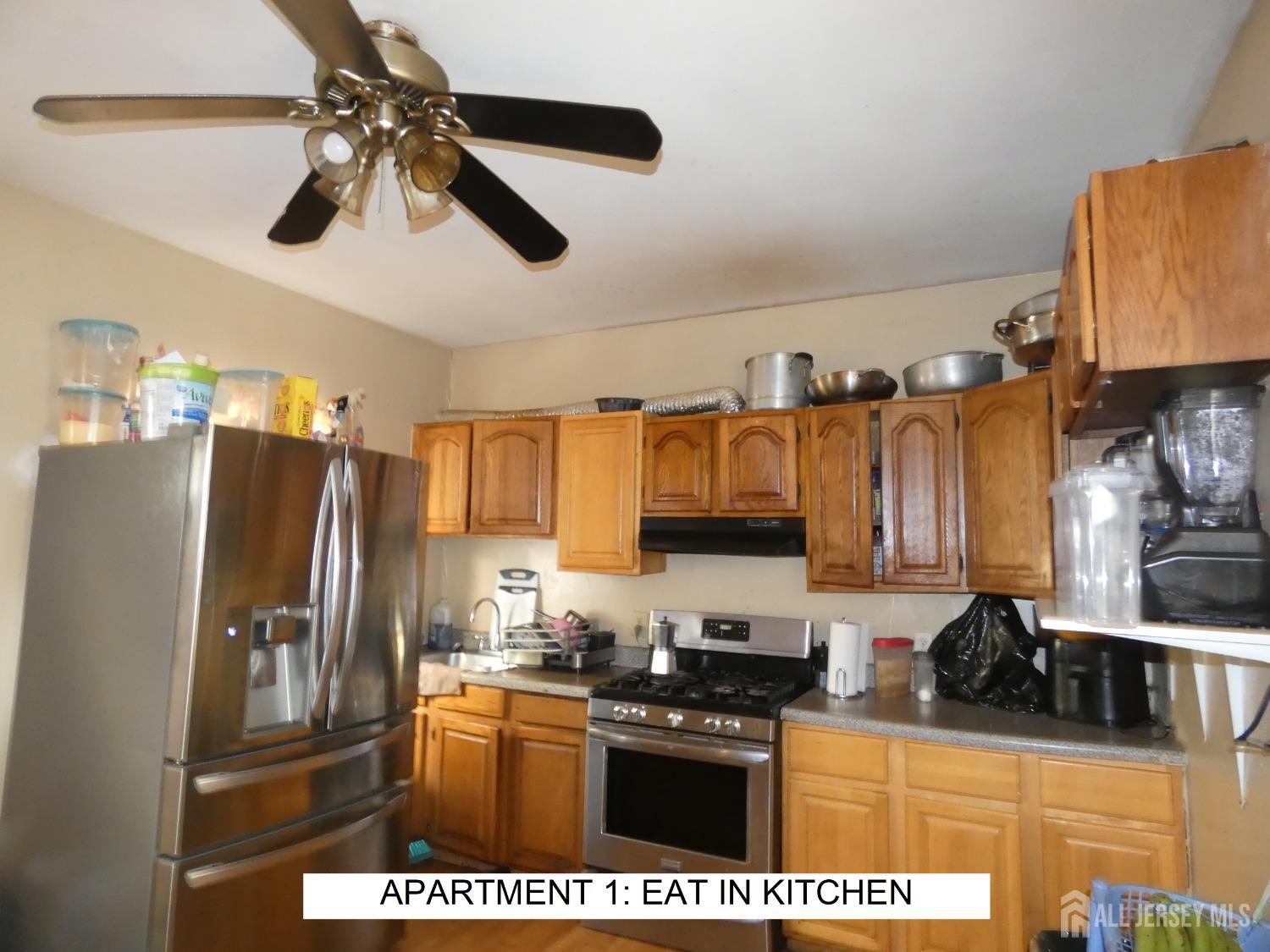 355 High Street Perth Amboy, NJ 08861 - Photo 4 of 19 a kitchen with stainless steel appliances granite countertop a refrigerator a stove top oven a sink and dishwasher