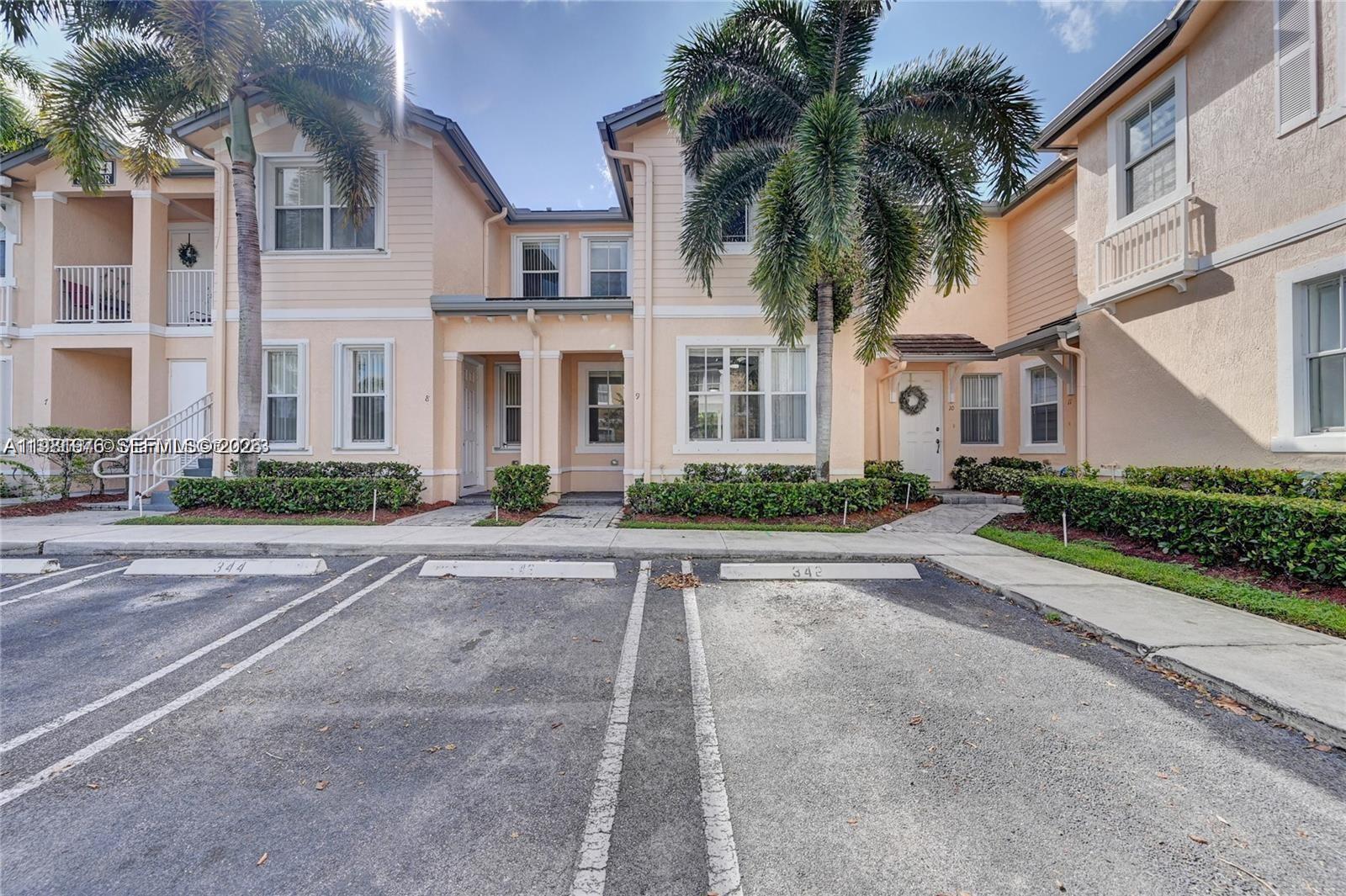 2884 Southeast 2nd Drive, Unit 5 Homestead, FL 33033 - Photo 1 of 1 a front view of multiple houses with yard