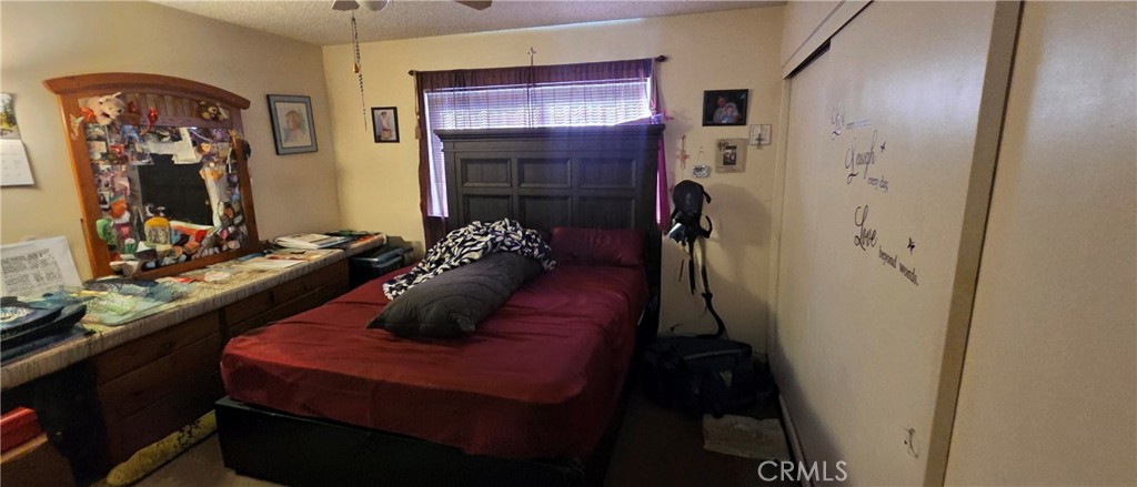 1548 Ranch Road San Bernardino, CA 92407 - Photo 17 of 26 a living room with furniture and a window