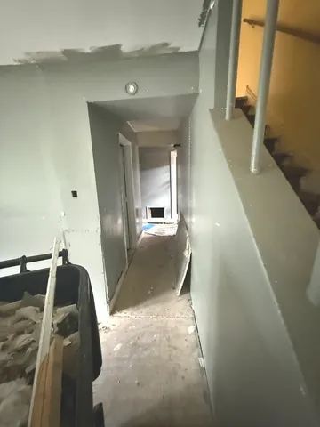 a view of a hallway view with staircase