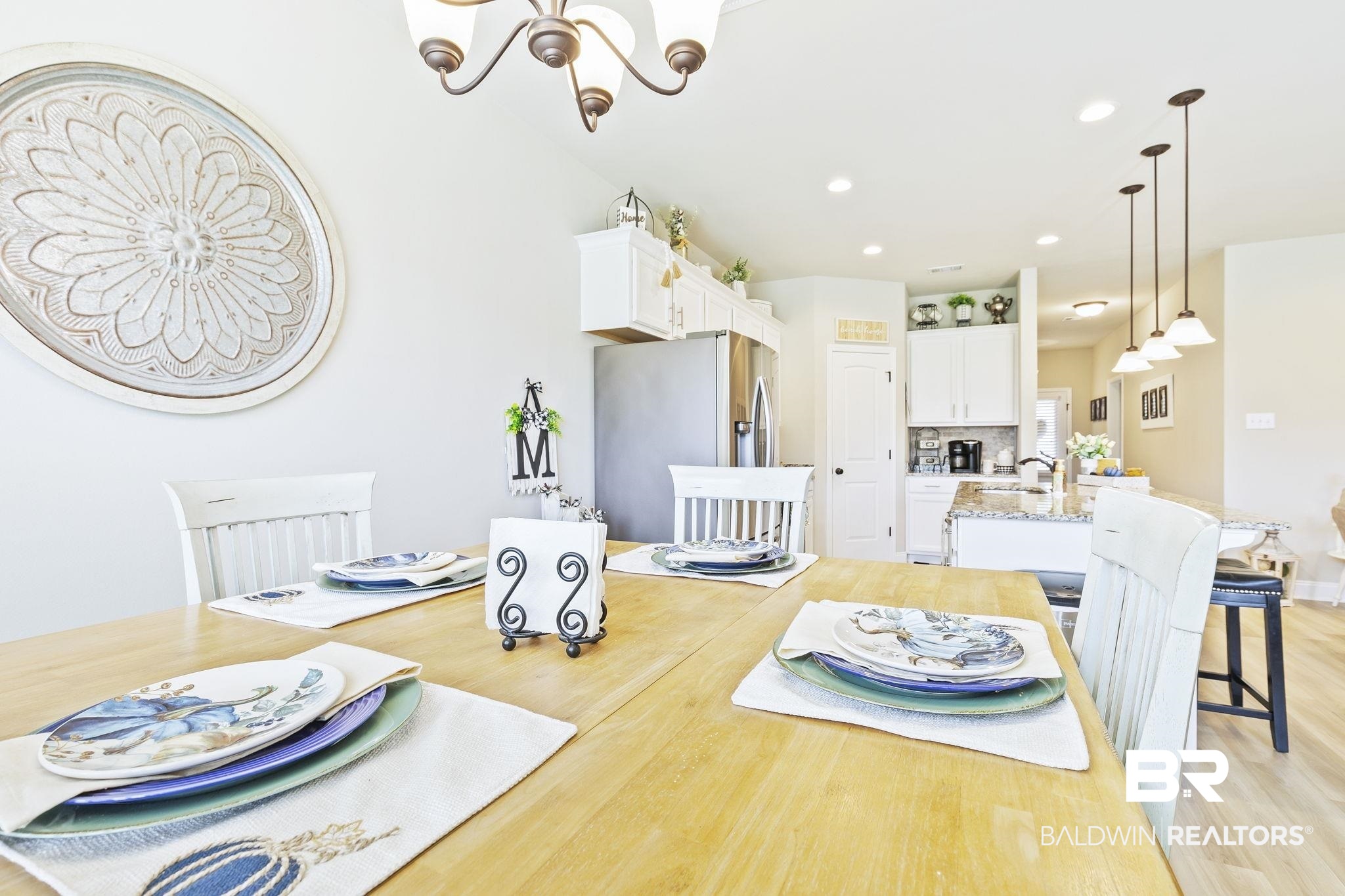 910 Gibson Court Foley, AL 36535 - Photo 23 of 66 Nice area for a dining table with lots of light and open to kitchen and living room areas. Features LVP throughout.